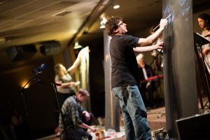 Artists from the congregation paint live during a special service. Photo: Nathan Siner/The Siners Photography.