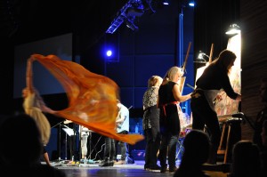 Three artists paint live on stage as a dancer moves nearby during worship at Bethel Church, Redding, CA. Photo: JSM.