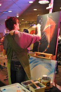 An artist paints live during worship at a Midwestern church. Photo: JSM.