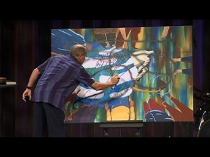Figure 9.2. Chris Dolson destroys the painting by cutting it with a knife. Photo used with permission of Blackhawk Church.